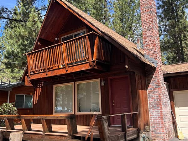 Deck staining and exterior painting services in El Dorado County Placer County by Dowell's Painting Two-story cabin with fresh exterior paint and deck staining
