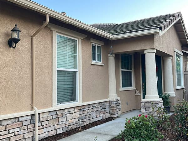 Residential painting services in El Dorado County Side view of a newly painted residential home