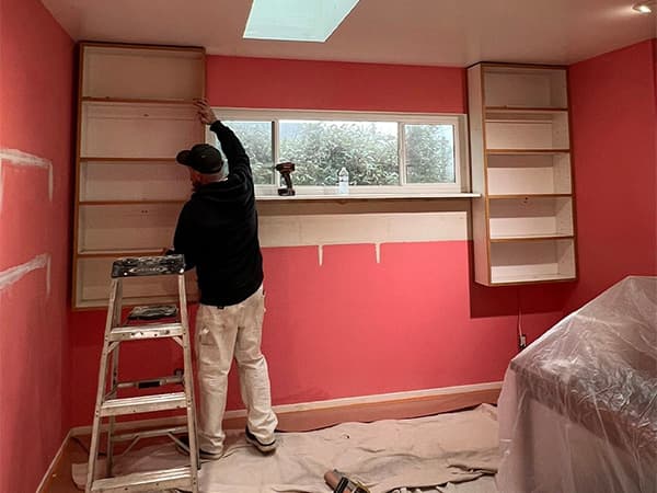 Interior painting services in El Dorado County, Placerville CA Interior bedroom being painted red by professional painter